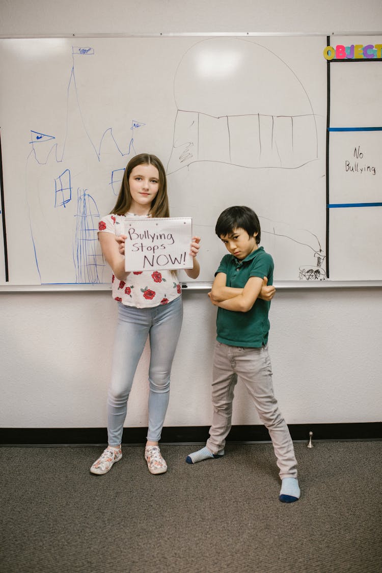 Two Students Showing A Message Against Bullying