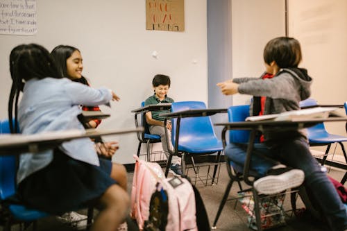 Free Boy Getting Bullied by His Classmates Stock Photo
