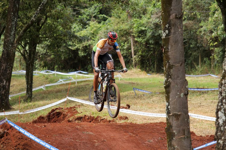 A Mountain Biker Riding A Bike Course