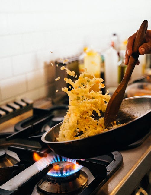 Free Cooking Fried Rice in Frying Pan Stock Photo