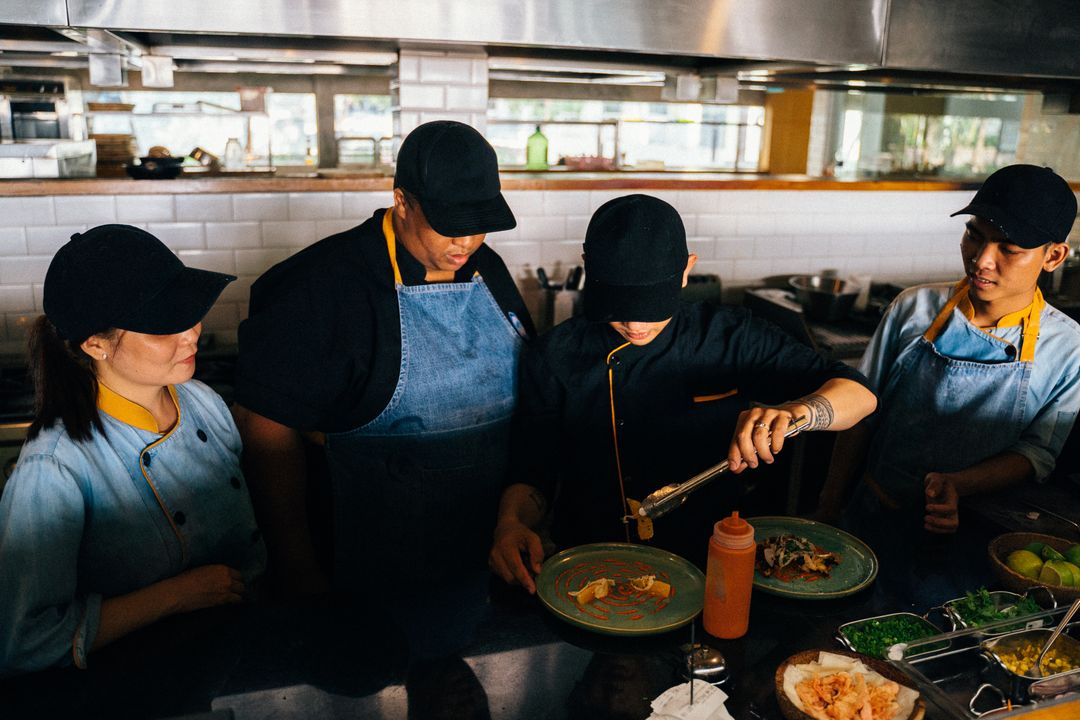 Chef Job Interview in India: Questions to Expect and How to Prepare 2 Chefs working together in a professional kitchen, plating dishes with precision