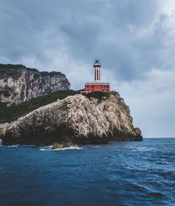 Lighthouse on a headland — photo by Mauricio Artieda on Pexels
