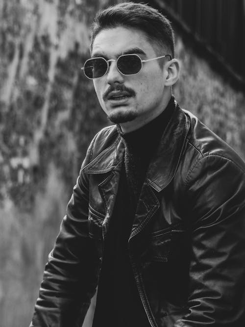 Portrait of a Young Man in Leather Jacket and Sunglasses 