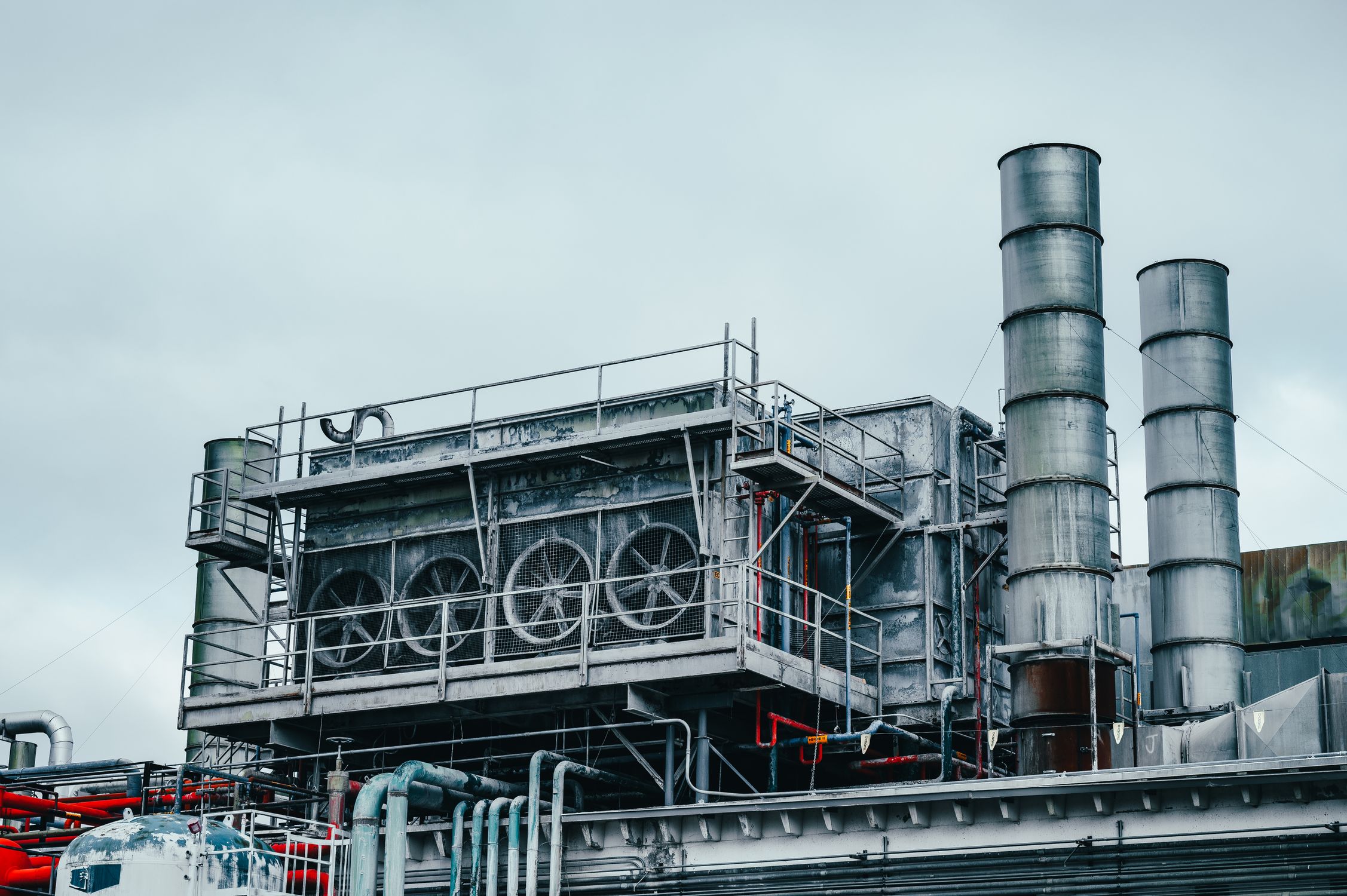 Industrial factory building with pipes · Free Stock Photo