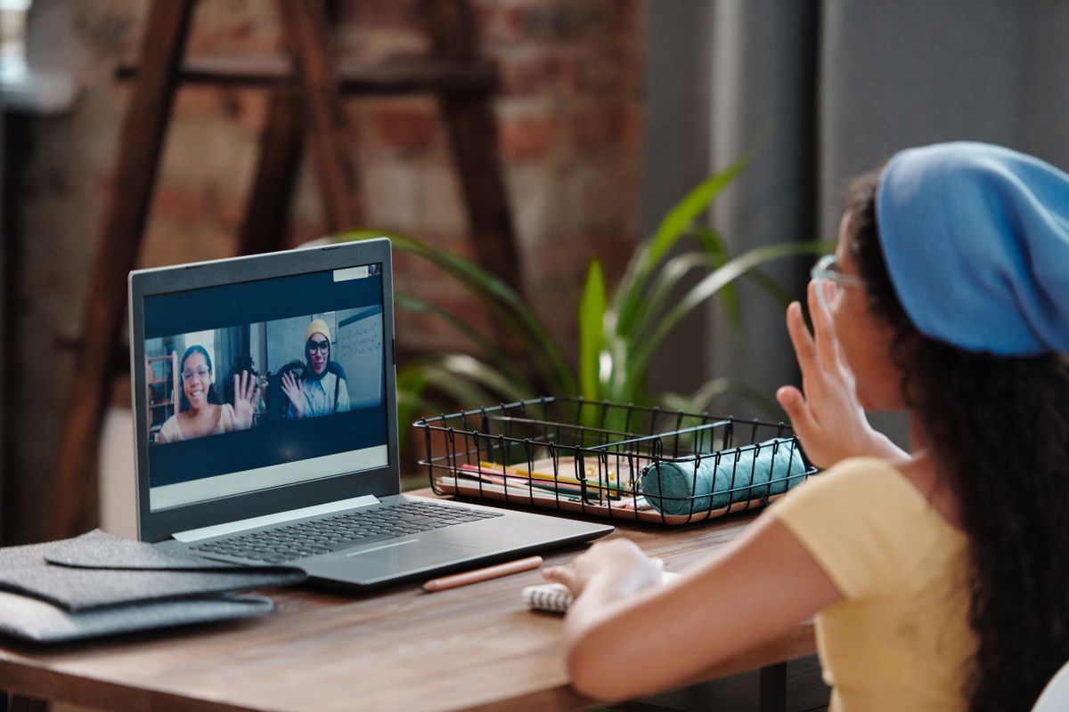 Girl engaged in online learning session on laptop