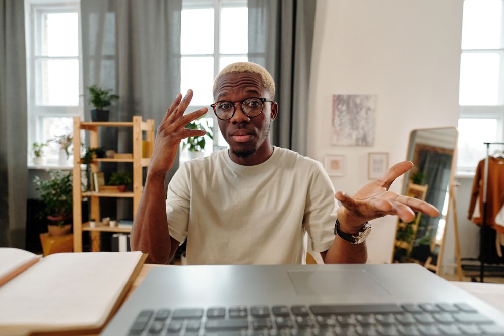 Live camera feed of a participant recording a reply at a home desk — photo by Diva Plavalaguna on Pexels