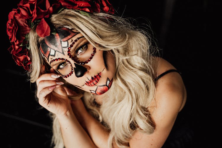 Stylish Young Woman With Mexican Catrina Inspired Makeup Looking At Camera