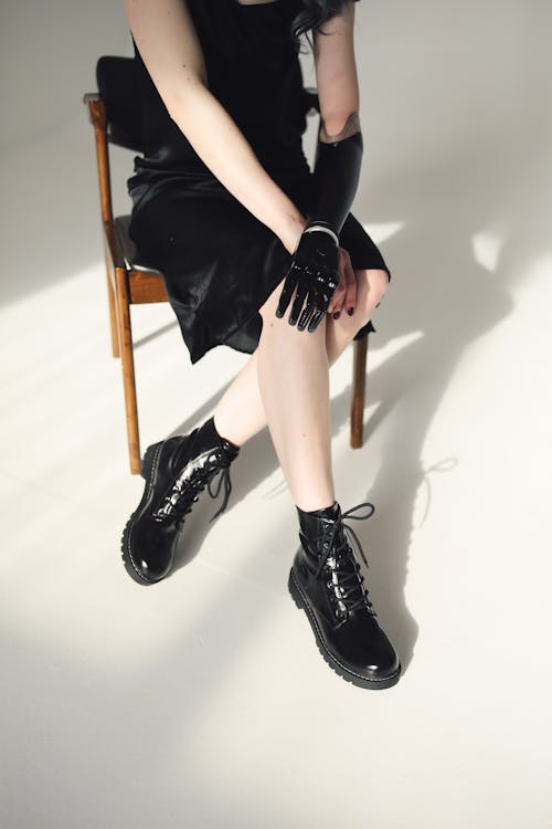 Photo Of Person Sitting On A Wooden Chair