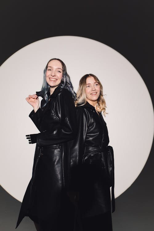 Free Photo Of Women Standing Back To Back At Each Other Stock Photo