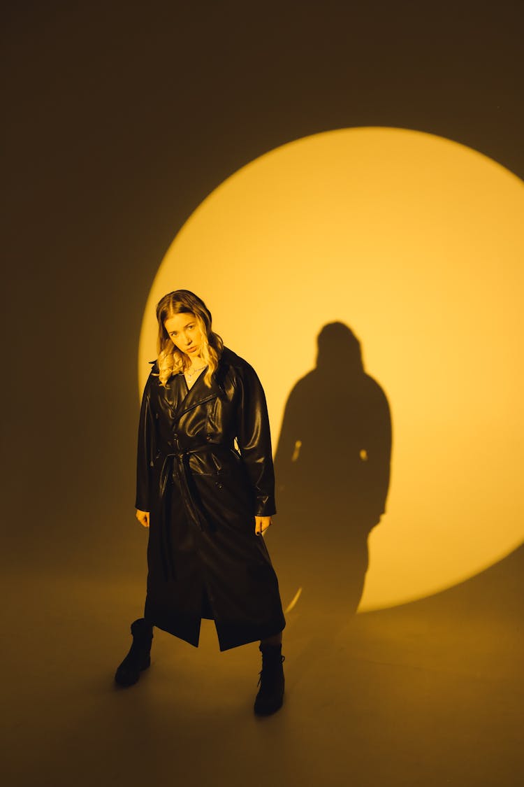 Photo Of Woman Standing Wearing Black Leather Coat 