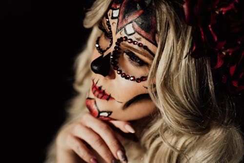Free Woman With Red and Black Face Paint Stock Photo