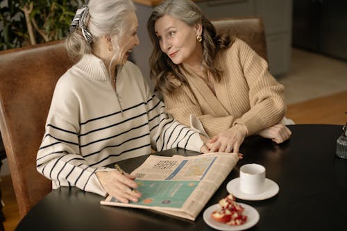 Women Laughing While Playing Puzzle