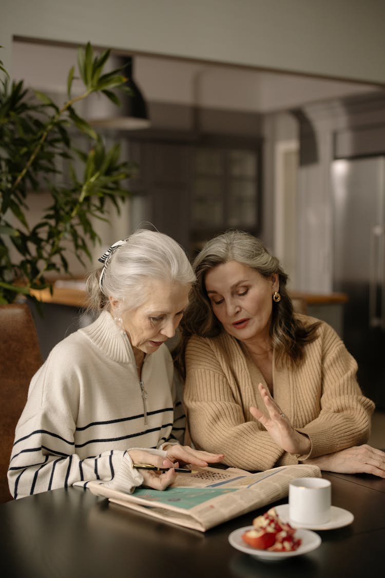 Women Solving The Newspaper Crossword Puzzle