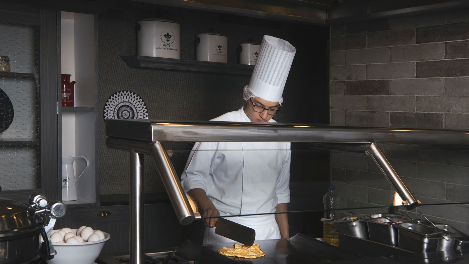 Professional chef cooking in a commercial kitchen for a chef and cook tax deduction guide in Australia
