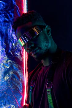 Dynamic cyberpunk portrait featuring a man with reflective eyewear and vibrant neon lights.