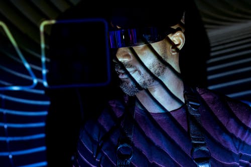 Man in Costume with Goggles in Darkness