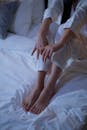 Person in Sleepwear Sitting on a Bed