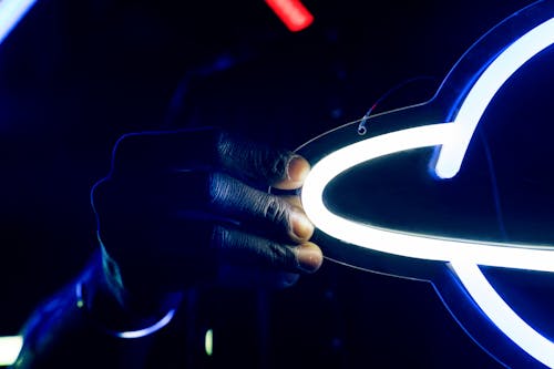 Free Person Holding a Neon Light Stock Photo