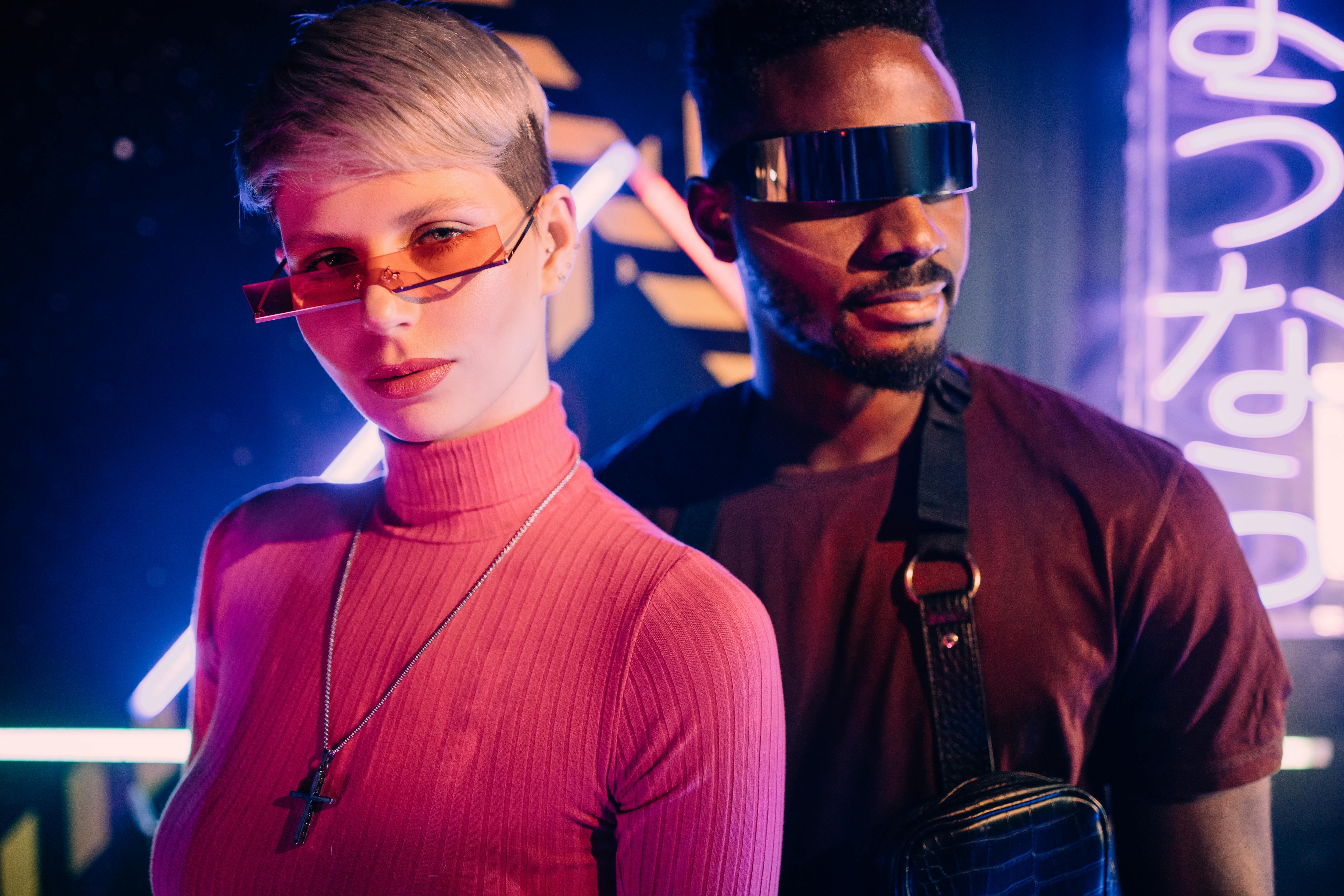 a man and a woman wearing futuristic sunglasses