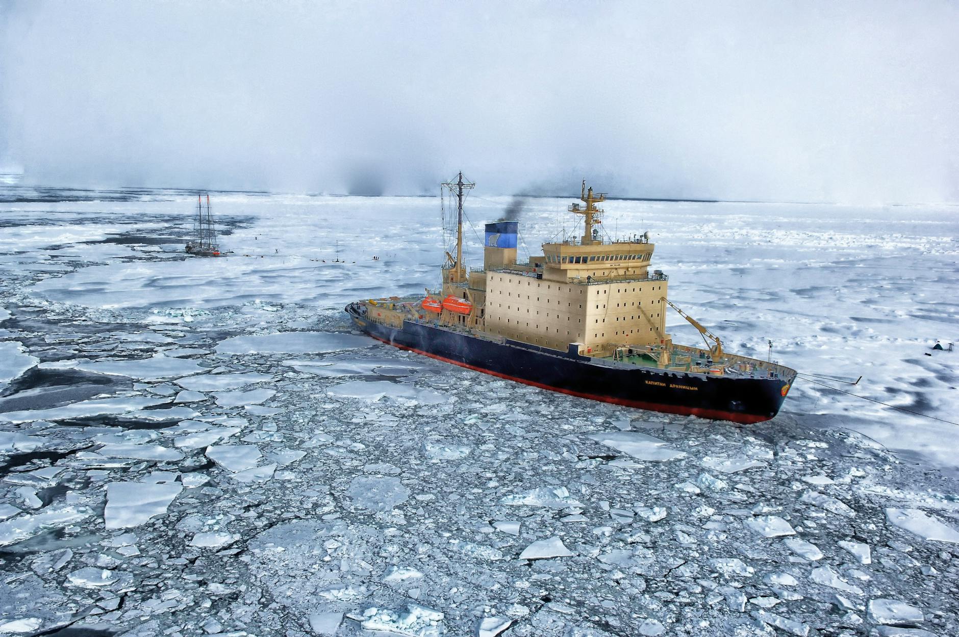 https://www.pexels.com/photo/black-and-gray-ship-on-water-with-ice-69406/