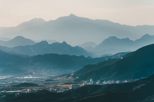 Scenic view of a misty mountain range in China, capturing nature's serene beauty.