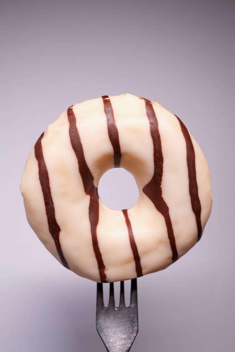 Delicious Doughnut Covered With Glaze In Gray Studio