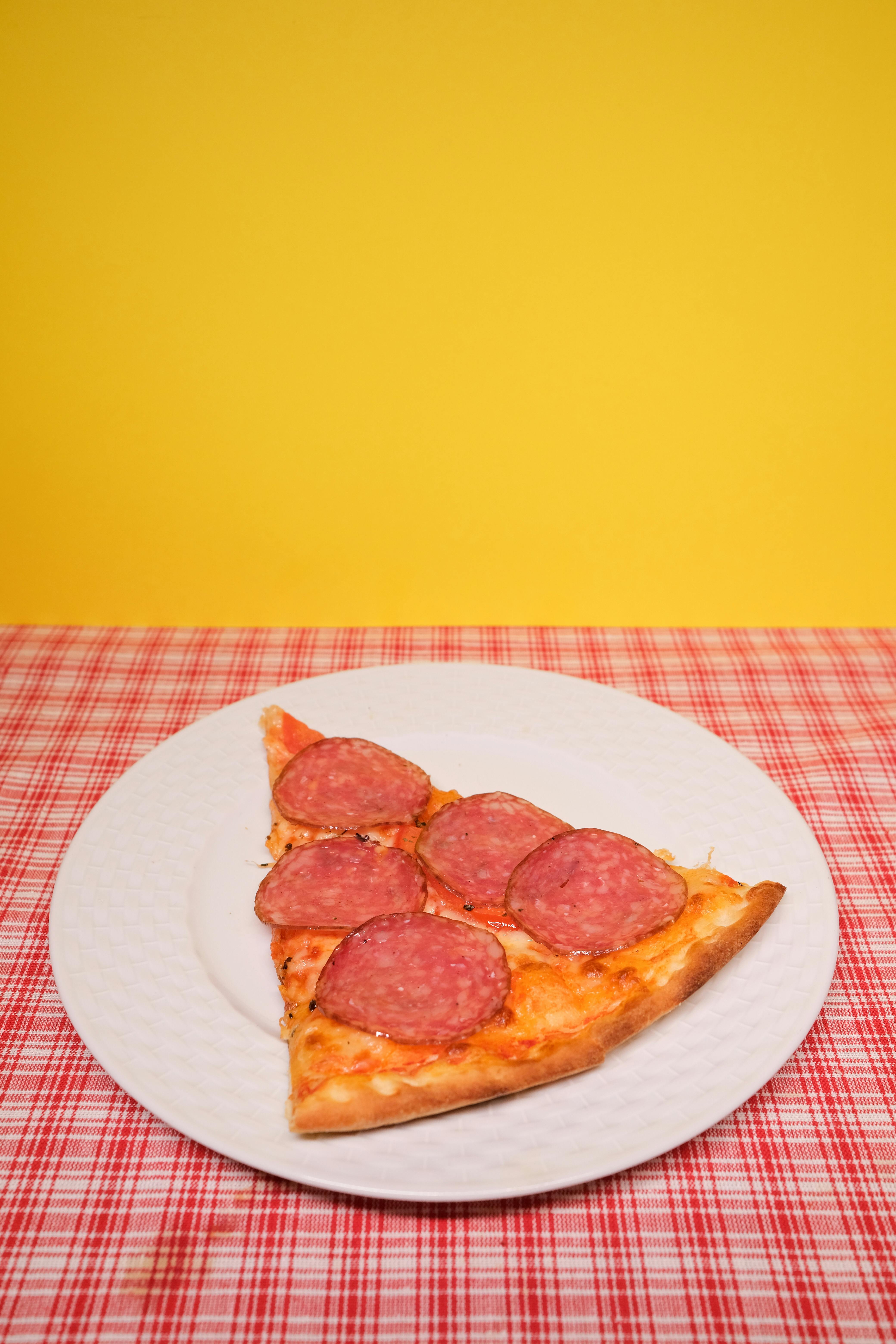 slice of yummy pizza served on table in kitchen