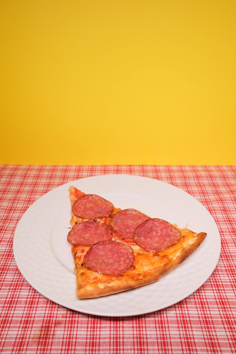 Slice Of Yummy Pizza Served On Table In Kitchen