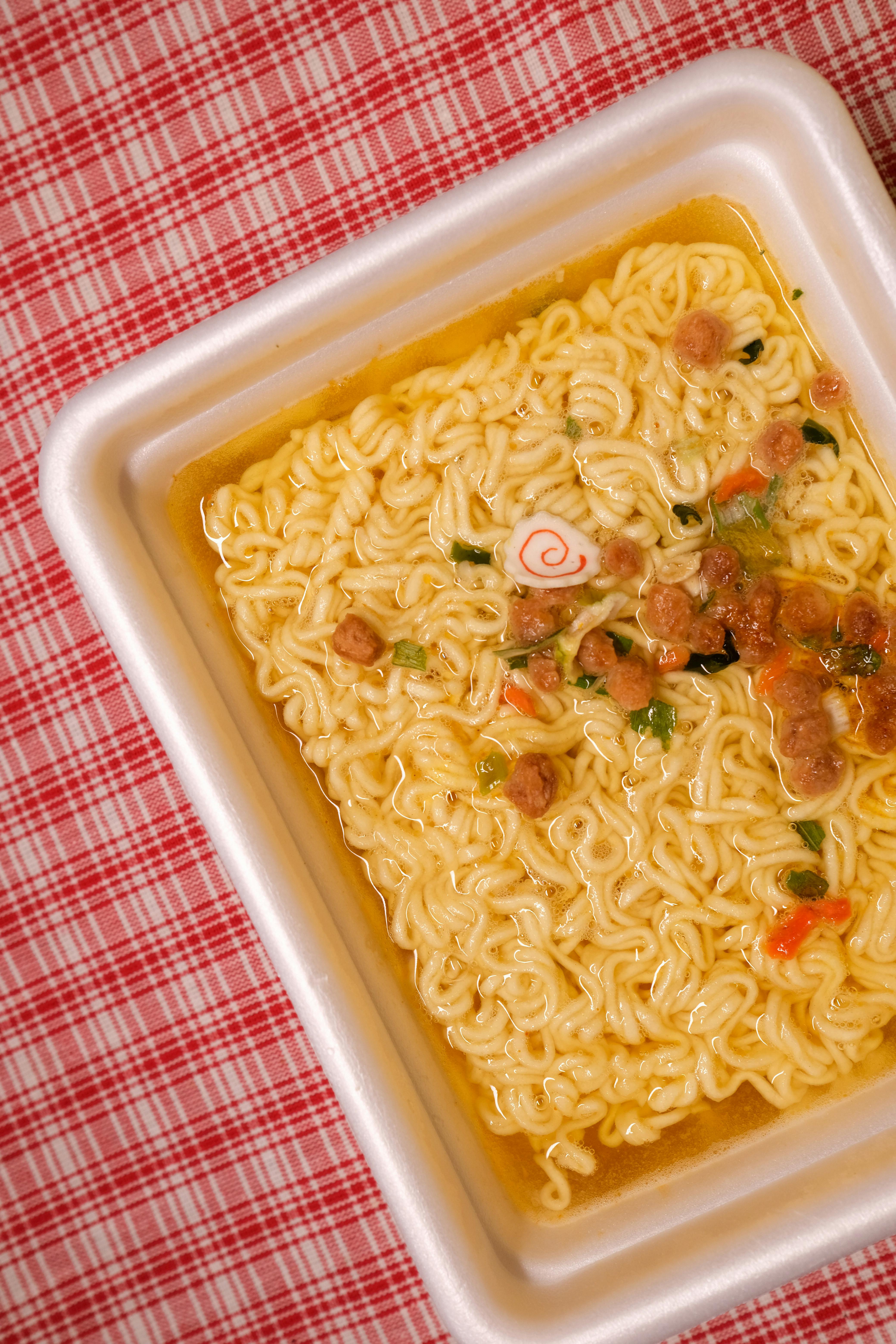 Eating Of Instant Ramen From Lunch Box Stock Photo - Download