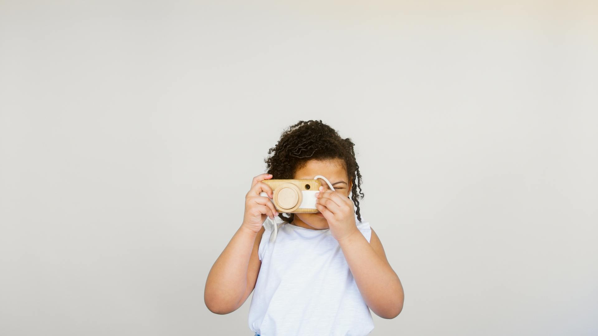 Girl Taking Photo Using a Camera