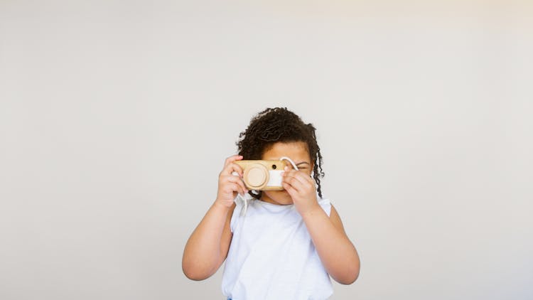 Girl Taking Photo Using A Camera