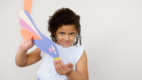 Girl Holding Her Artwork