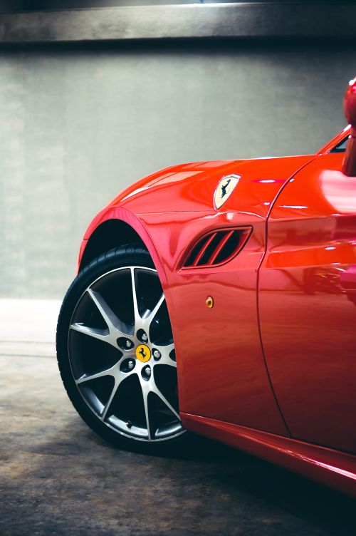 Free Part of expensive modern sport car with shiny reflective body parked in garage under light Stock Photo