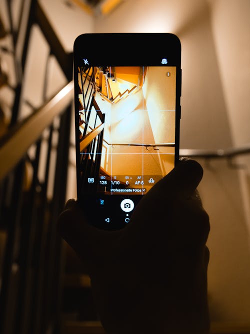 Free Person Holding Smartphone Showing Camera Application Stock Photo