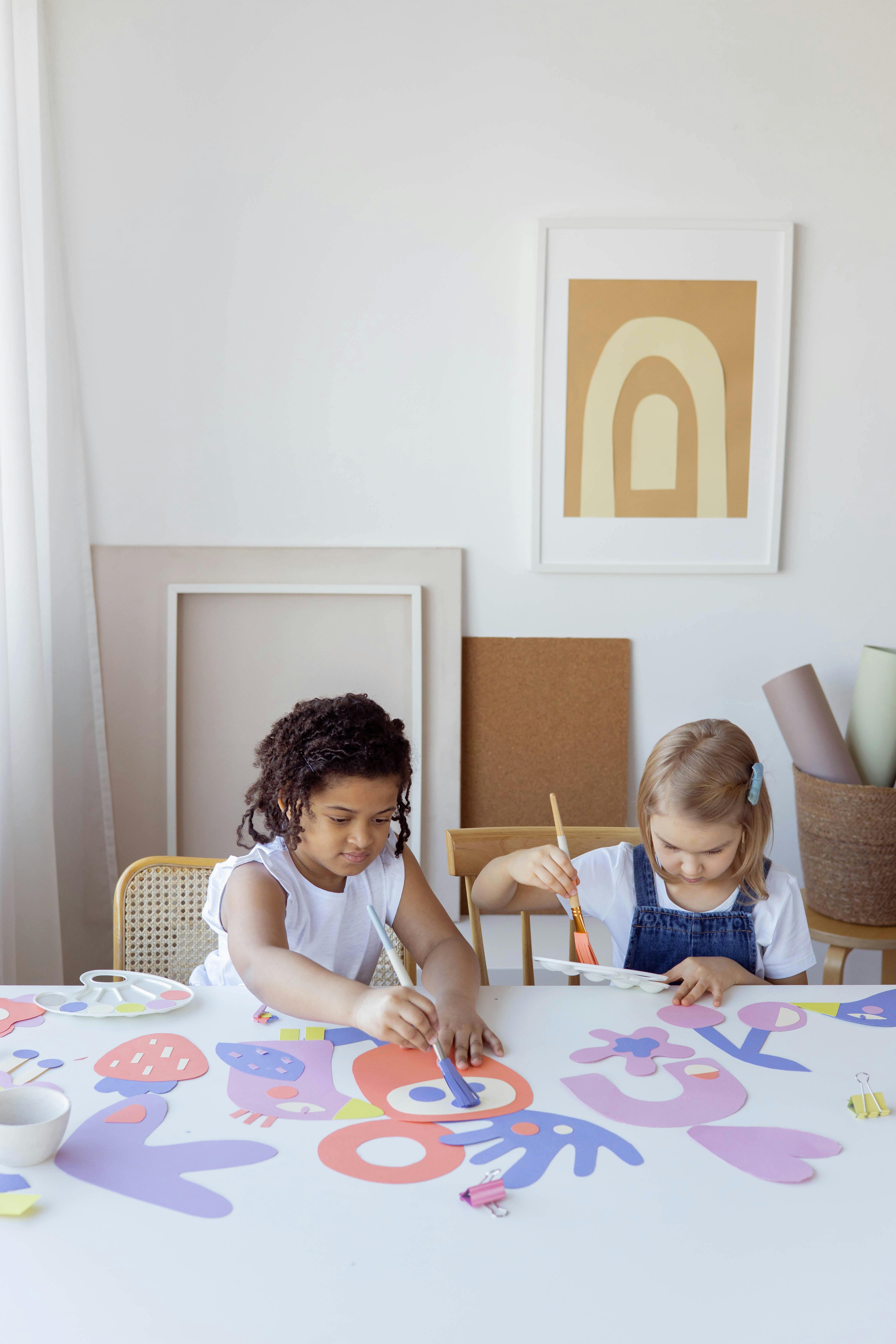 two kids doing some artworks