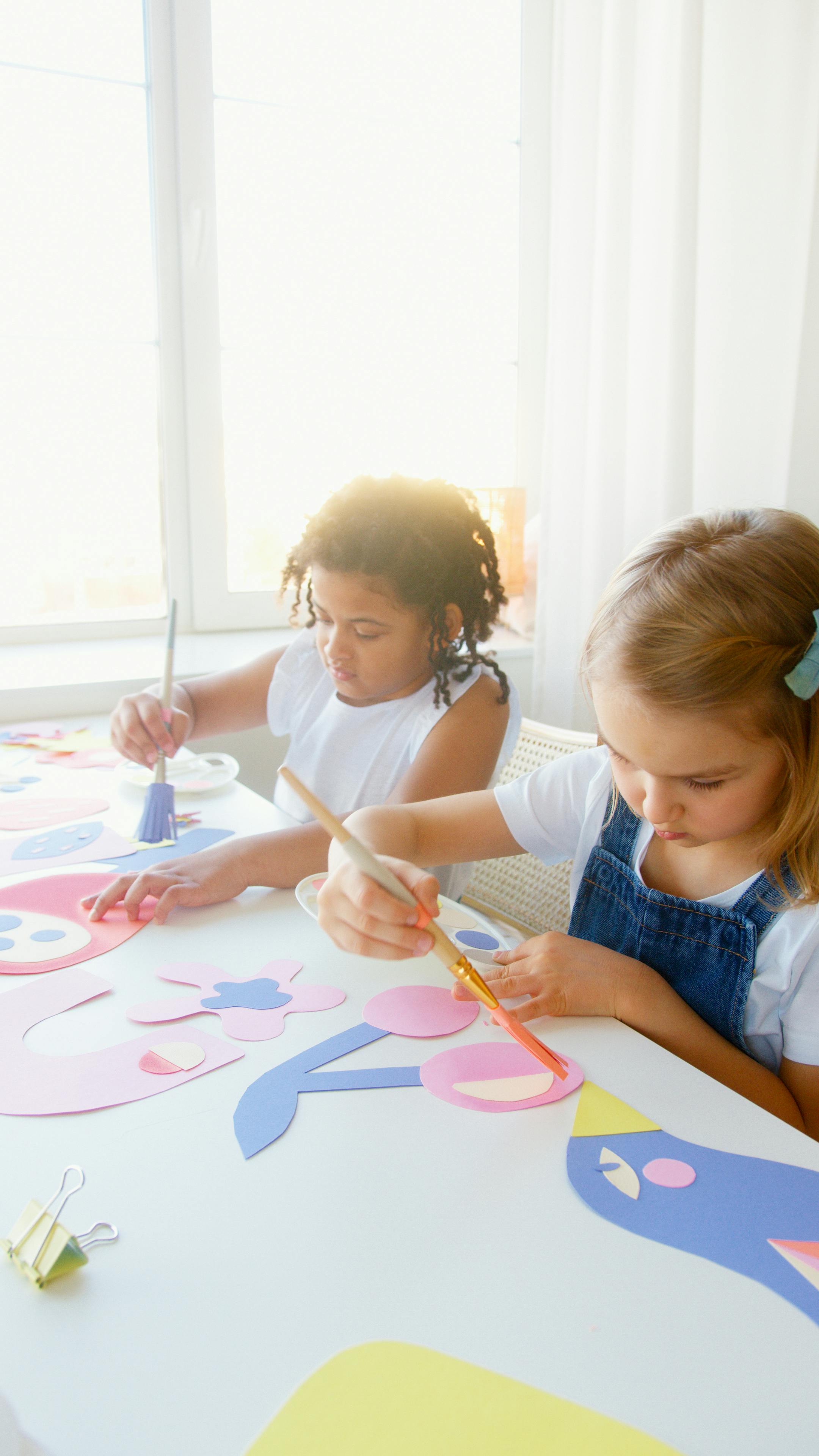 two kids doing some artworks