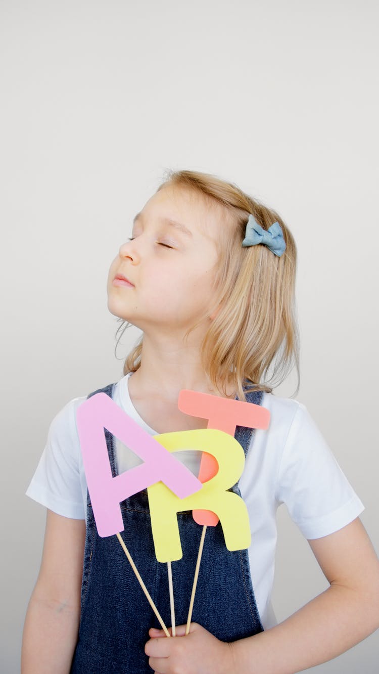 Girl Holding Her Artwork