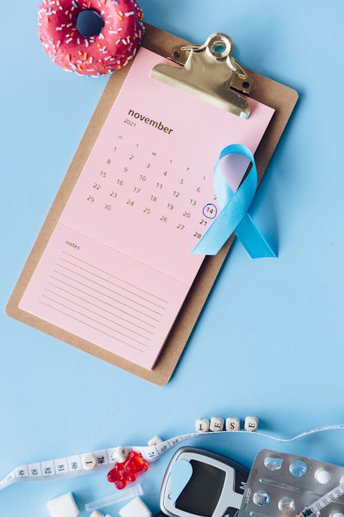 Ribbon and Donut on a Clipboard with Calendar