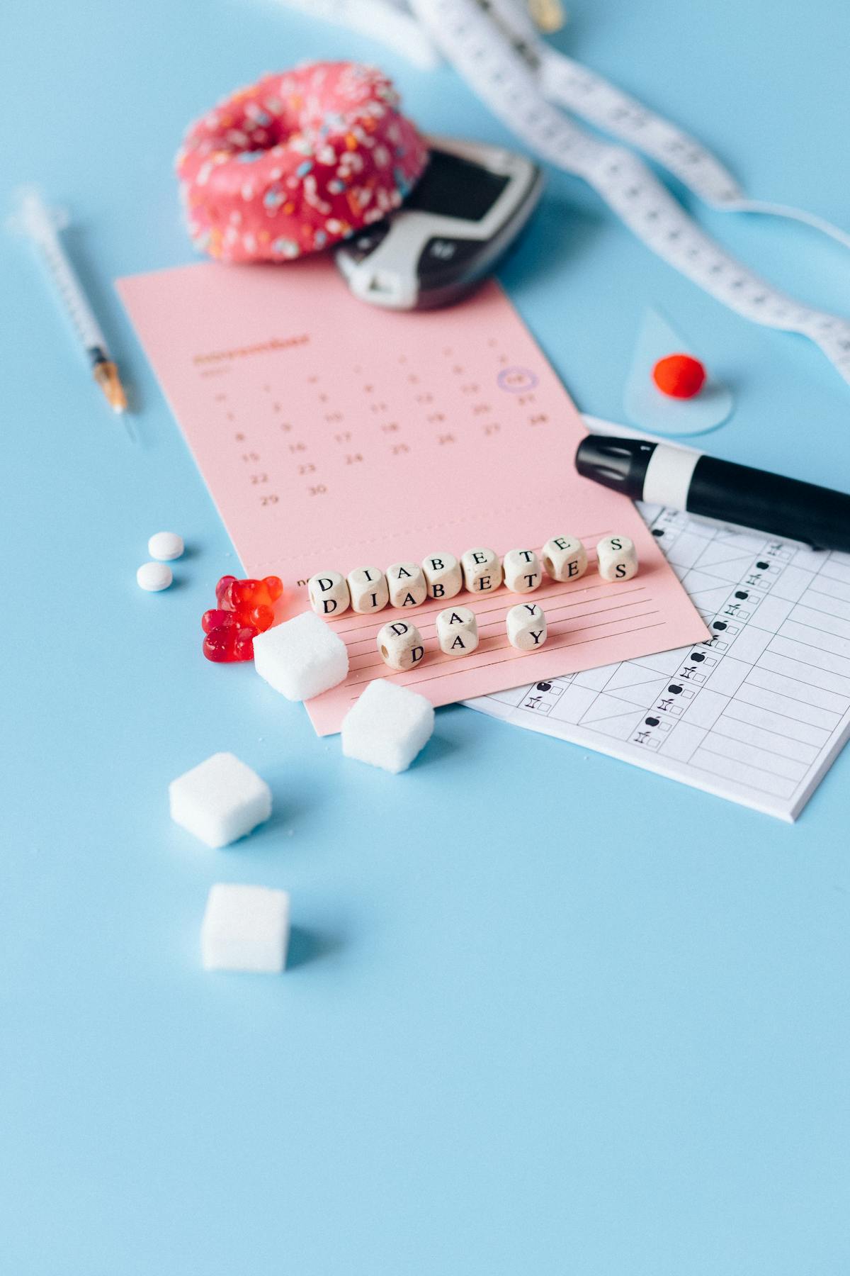 Person holding a weekly pill organizer and notebook, symbolizing medication and health planning