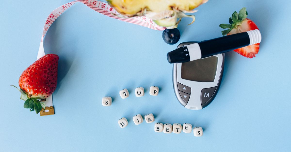 Conceptual flat lay with fruits, glucose meter, and message for diabetes prevention. - Evidence evidence guide for Akkermansia metabolic health meta-analysis