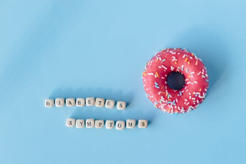 Free A Doughnut and a Message over Blue Surface Stock Photo