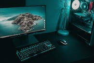 Table with computer and keyboard in room