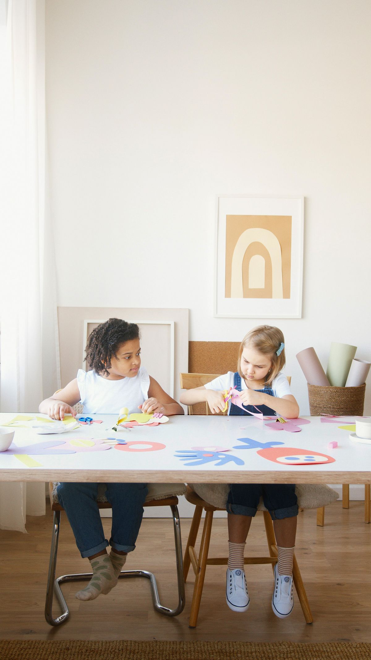Children creating colorful arts and crafts together at a table