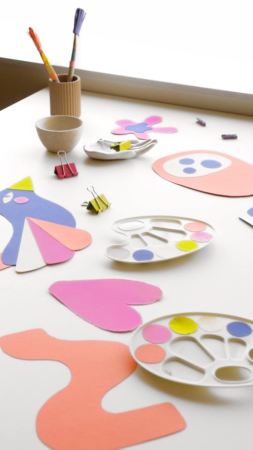 Colorful Artworks on White Table