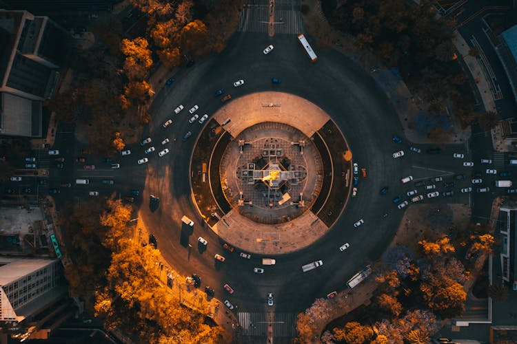 An Aerial Photography Of Moving Cars On A Roundabout