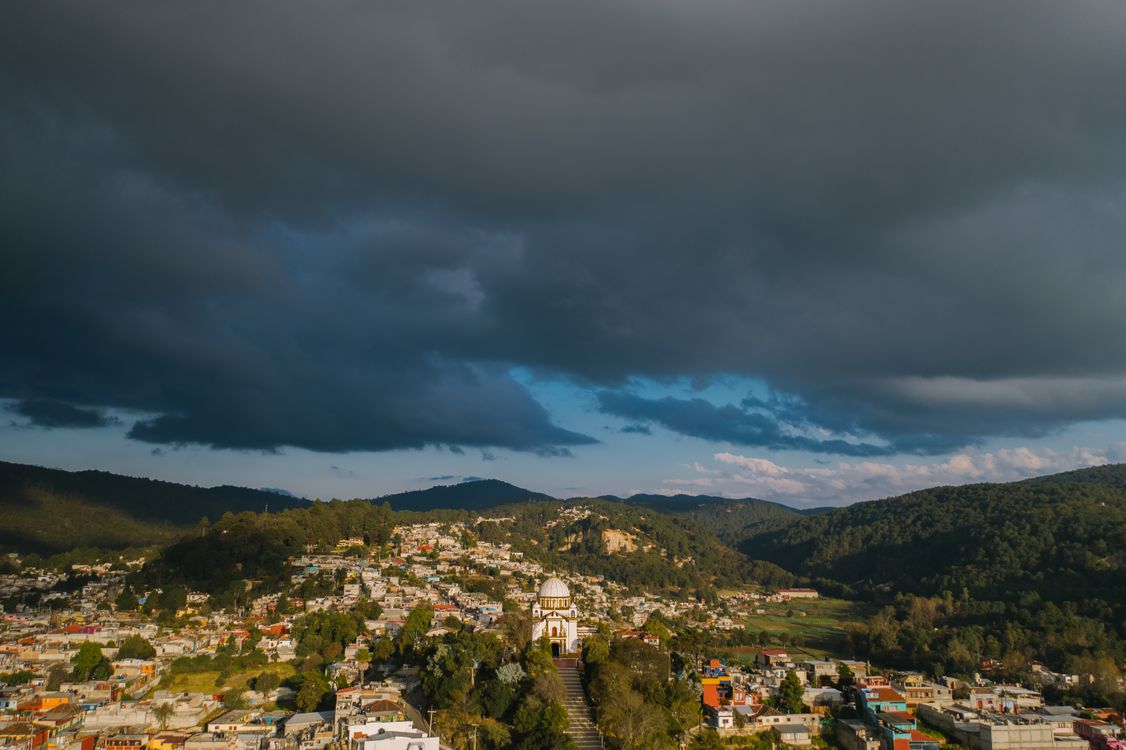 Aerial View of City Under Cloudy Sky · Free Stock Photo