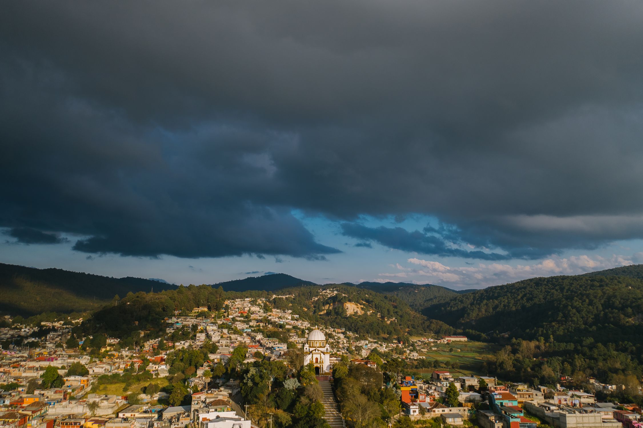 Aerial View of City Under Cloudy Sky · Free Stock Photo