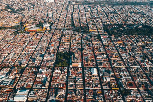 Free Stunning aerial shot capturing the vibrant layout of a bustling city. Stock Photo