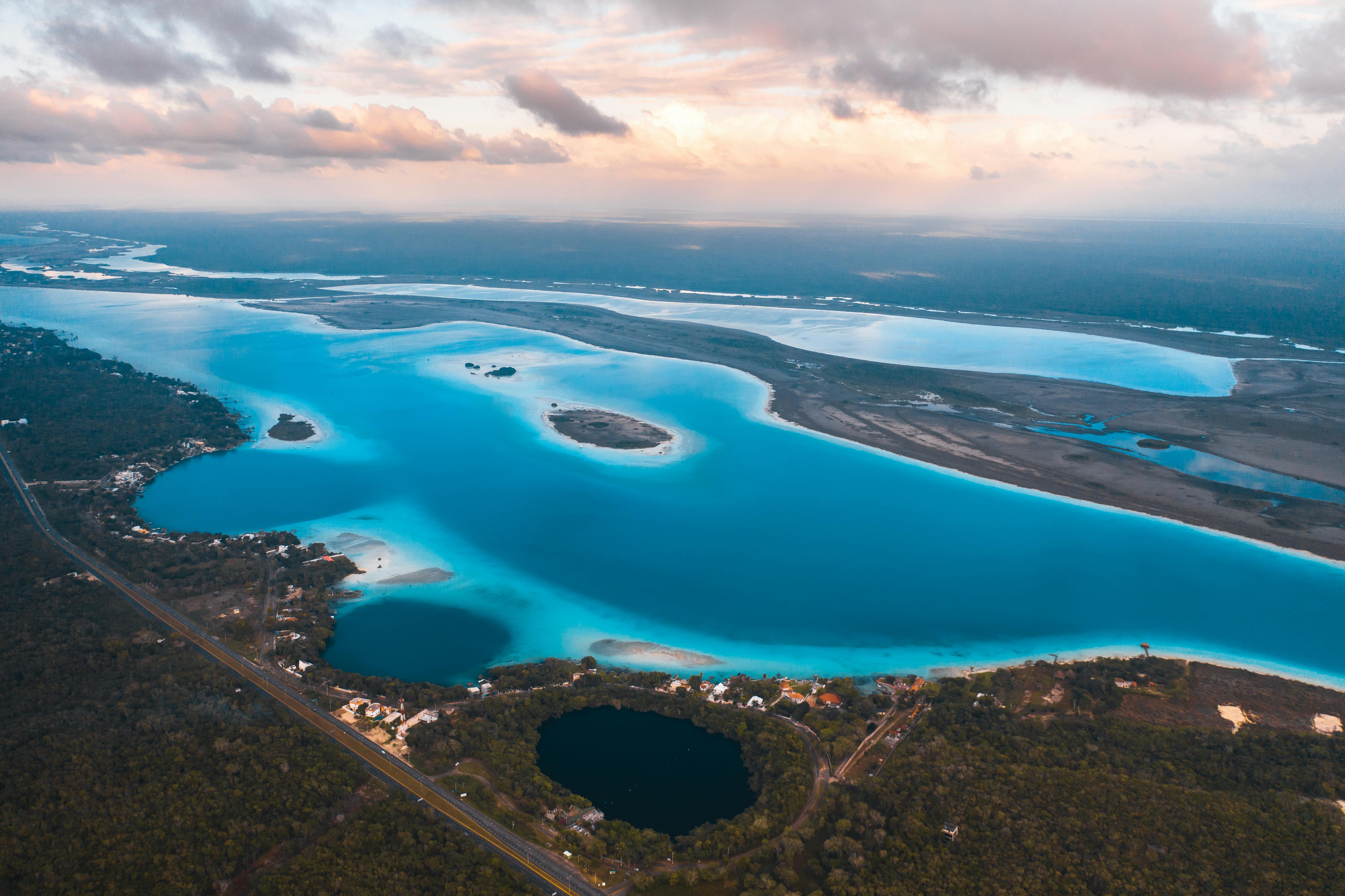 aerial view of blue lake under cloudy sky