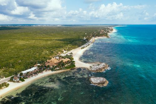 Free Stunning aerial view of the pristine coastline and lush greenery in the Riviera Maya, Mexico. Stock Photo